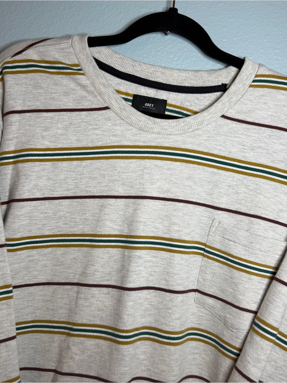 Obey Men’s Cream Long Sleeve Striped Pocket Tee with Green and Brown Accents